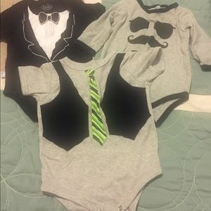 Lot of onesies in faux tux/tie design